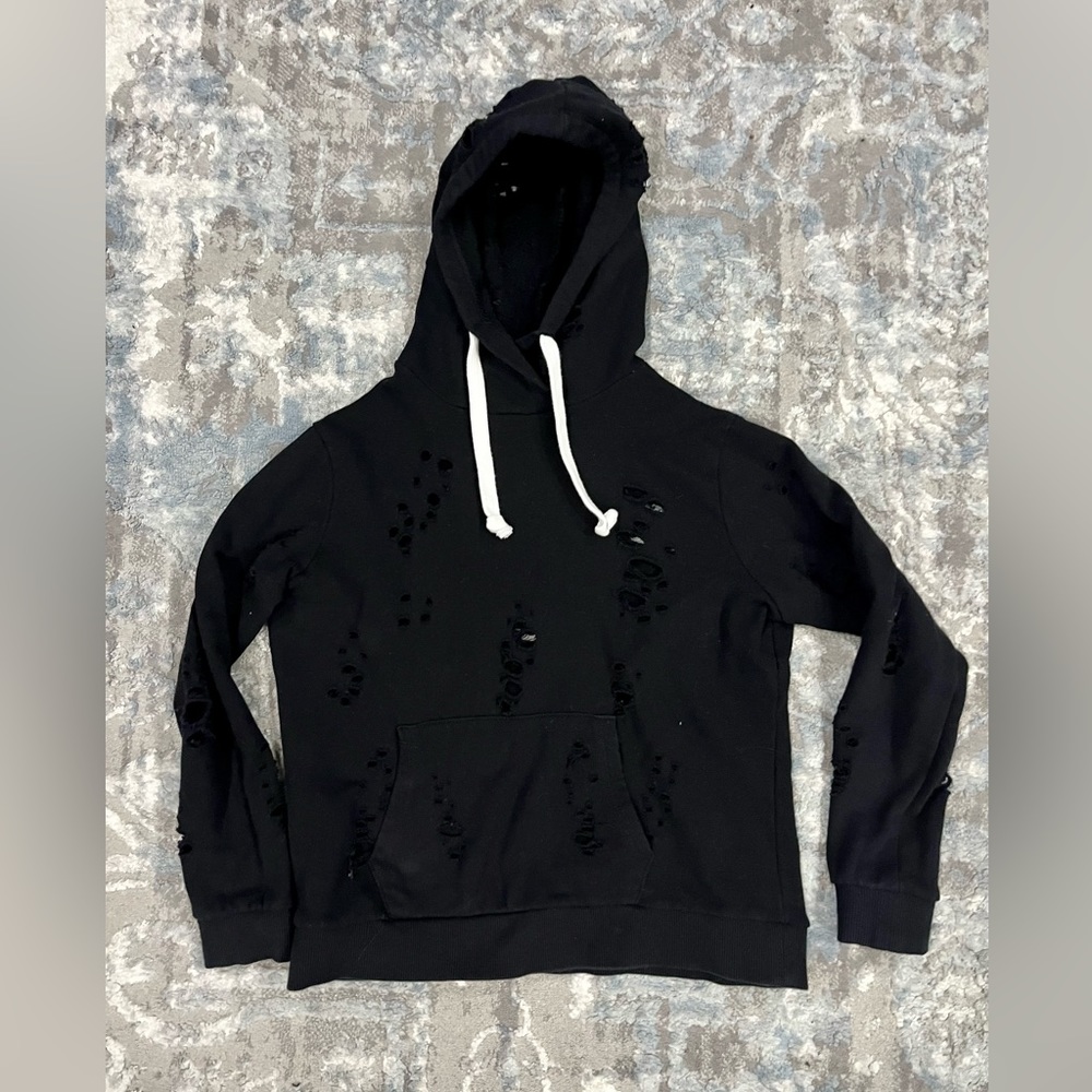 Katie J black hooded sweatshirt with fashion holes. Size youth XL.